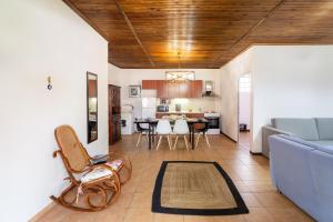 a living room with a couch and a table at Oasis Houses Maggana ,Xanthi in Mángana