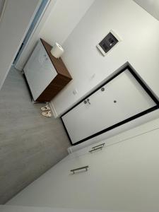 an overhead view of a room with a stairway with a stair at Garsoniera mobilata si utilata in Chiajna
