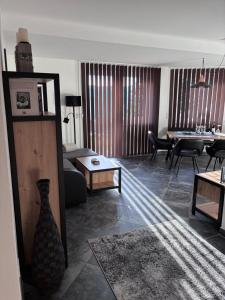 a living room with a couch and a table at Ferienwohnung Gritsch Sommercard inclusive in Jerzens