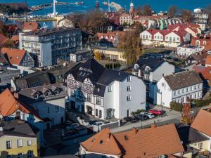an aerial view of a town with buildings at Hotel Rejs in Ustka