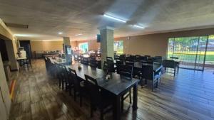 a dining room with tables and chairs in a restaurant at Silhouette Guesthouse in Welkom
