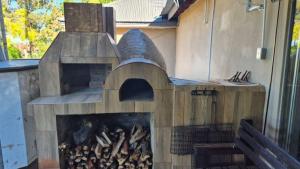 a wood fired pizza oven in a patio at Silhouette Guesthouse in Welkom