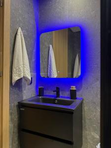 a bathroom with a black sink and a mirror at Luxury Studio Casa Center in Casablanca +50 photos