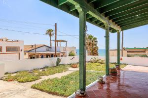 a porch with a view of the ocean at Las Mareas #21 in Puerto Peñasco