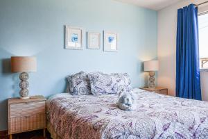 a bedroom with a bed with a stuffed animal on it at Las Mareas #21 in Puerto Peñasco