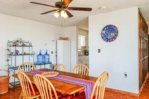 a dining room table with chairs and a ceiling fan at Las Mareas #21 in Puerto Peñasco +8 photos