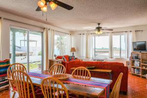 a living room with a table and a couch at Las Mareas #21 in Puerto Peñasco