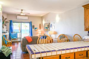 a living room with a bed and a couch at Paradise Villas #16 in Playa Encanto