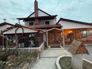 a home with a house with a roof at Oasi in Kato Loutraki