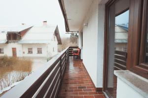 a balcony with a view of a building at M&M apartma in Bohinj