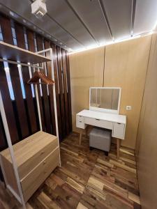 a room with a desk with a mirror and a computer at YSR Himalaya Resort in Mantaak +39 photos