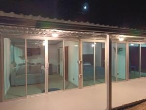 a room with glass doors and a bed at Cabaña - Macanal in Macanal