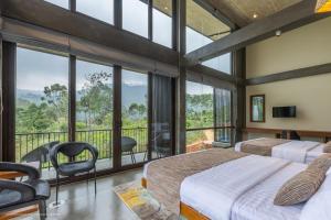 a bedroom with two beds and a balcony at Sathkara Resort Ella in Ella +96 photos