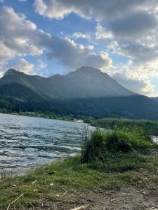 a view of a lake with a mountain in the background at Feneos apartment in Feneos +15 photos