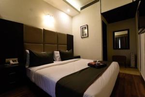 a bedroom with a large bed in a room at Castle in Bharatpur