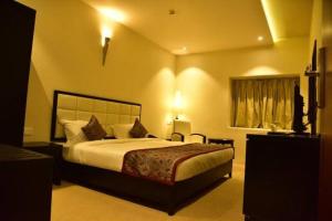 a bedroom with a large bed in a room at Castle in Bharatpur