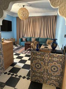 a living room with a couch and a table at Amazing apartment with traditional touch in Taskala