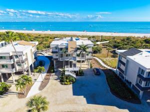 an aerial view of a building and the beach at Shell Island Beach Club #5D in Sanibel