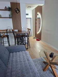 a living room with a couch and a table at Jahorina Lux in Jahorina +16 photos