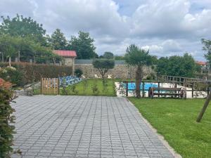 a garden with a brick walkway and a pool at Quinta do Sobrado in Braga +85 photos