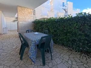 a table and chairs sitting on a patio at Residence Lucrezia in Nardò