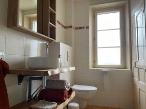 a bathroom with a sink and a toilet at Veï Lou Quéri in Moutier-Malcard +24 photos
