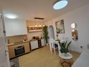a living room with a kitchen and a dining room at Rosa de la Sal in La Mata