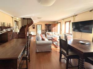 a living room with a couch and a table at Casa Los Campones en Asturias VV-3585-AS in Nava