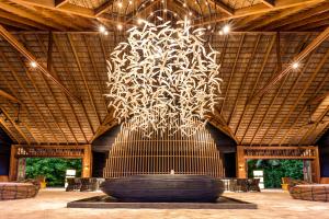 a large fountain in the middle of a building at Hurawalhi Island Resort in Kuredu