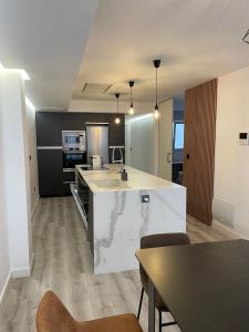 a kitchen with a sink and a counter top at Alicante City Suite 2 in Alicante