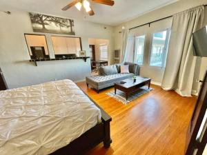 a living room with a bed and a couch at The Riviera in San Pedro +214 photos