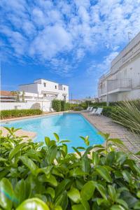 a swimming pool in front of a building at Residence Lucrezia in Nardò +9 photos