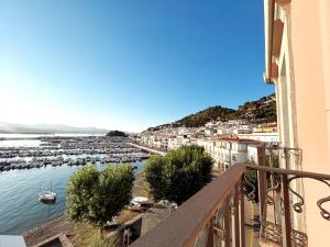 a view of a harbor from the balcony of a building at EDIFICI ROSA- Ático primera línea in Port de la Selva