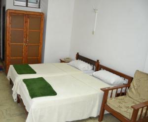 Postel nebo postele na pokoji v ubytování Manson Hotel