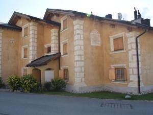 a large building with at Apartment Culaischem 1 by Interhome in Zuoz