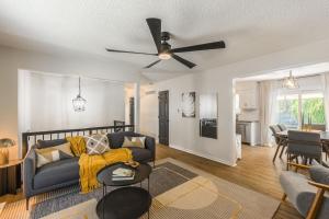 a living room with a couch and a ceiling fan at 4BR World Cup Fan HQ SuperHost Close to Stadium in Pleasant Valley