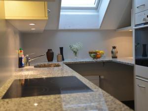 a kitchen counter with a sink and a window at Apartment Sunnebad Sternenberg by Interhome in Sternenberg
