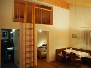 a room with a loft bed and a bedroom at Apartment Ballmoos Ferienwohnung by Interhome in Gais +5 photos