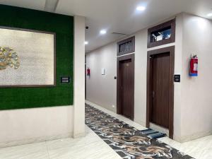 a hallway with two elevators in a building at Indian Happy Homes in Siar