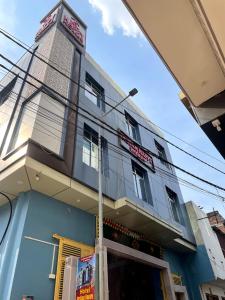 a building with a sign on top of it at Indian Happy Homes in Siar