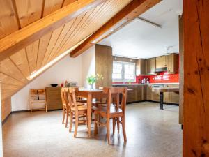 a kitchen and dining room with a table and chairs at Apartment Hof Bommes by Interhome in Gais