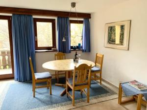 a dining room with a table and chairs at Apartment Chesa Engel by Interhome in La Punt-Chamues-ch