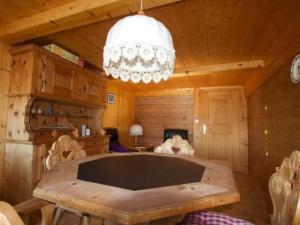 a large wooden room with a large tub in a cabin at Apartment Hasenbüel by Interhome in Ricken