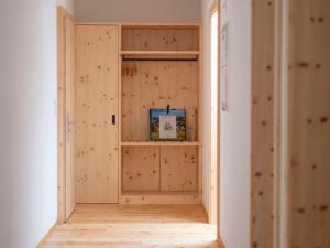 a room with a closet with wooden walls at Apartment Duai by Interhome in Müstair