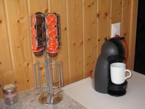 a counter top with a cup holder and a coffee maker at Apartment Gubel by Interhome in Alt Sankt Johann