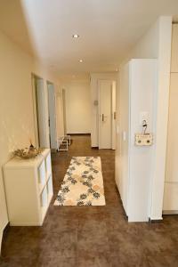 an empty room with a rug on the floor at Apartment Panoramablick by Interhome in Nesslau