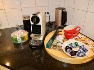 a counter top with a plate of food and a toaster at Apartment Panoramablick by Interhome in Nesslau