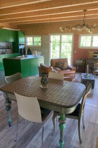 a table and chairs in a living room at Apartment nirkwerk by Interhome in Schönengrund