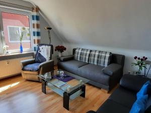 a living room with a couch and two chairs at Apartment Gill by Interhome in Stelle