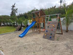 a playground with a slide and a climbing frame at The Heritage Roches Noires in Roches Noires